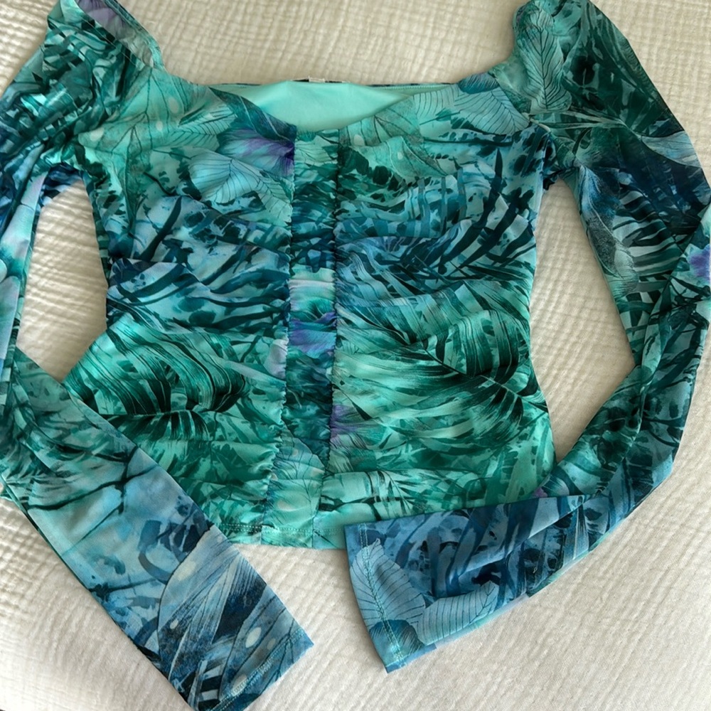 Dressy with sheer sleeves.